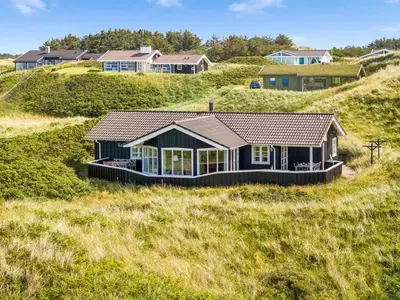 a house on the side of a hill at Holiday Home Kasperi - 250m from the sea by Interhome in Løkken