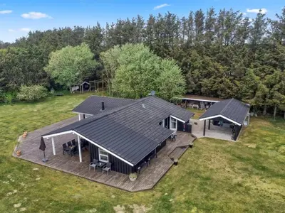 an aerial view of a house with a deck at Holiday Home Siljana - 1km from the sea by Interhome in Løkken