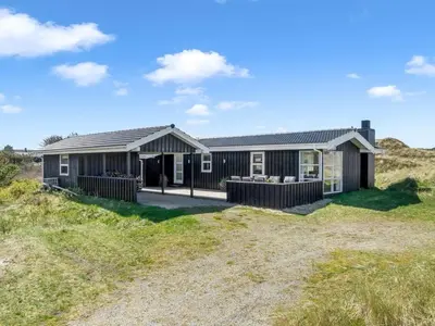 a house on the side of a field at Holiday Home Ingela - 350m from the sea by Interhome in Løkken