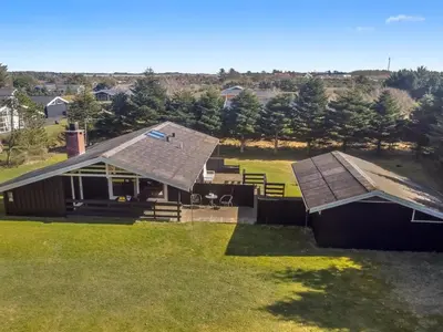 an aerial view of a house with a roof at Holiday Home Conradine - 500m from the sea by Interhome in Løkken