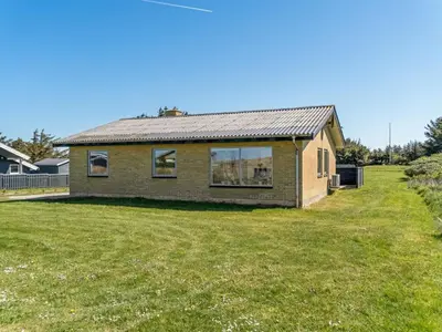 a house with a large yard in front of it at Holiday Home Nayeli - 275m from the sea by Interhome in Løkken