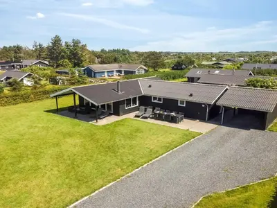 an aerial view of a house with a yard at Holiday Home Susan - 600m from the sea by Interhome in Løkken