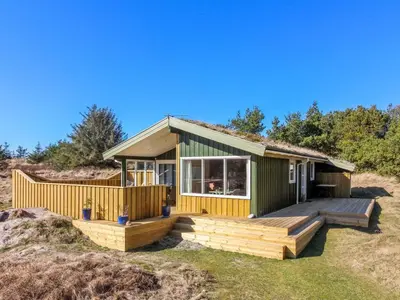 a house on the beach with a deck at Holiday Home Taina - 1-1km from the sea by Interhome in Løkken