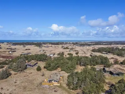 an aerial view of a house on a field at Holiday Home Taina - 1-1km from the sea by Interhome in Løkken
