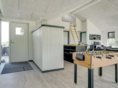 a large room with a table with a game board at Holiday Home Aldina - 1-5km from the sea by Interhome in Løkken