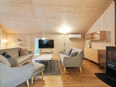 a living room with two couches and a tv at Holiday Home Elsemaria - 1-3km from the sea by Interhome in Løkken