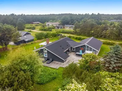 an aerial view of a house with a yard at Holiday Home Lempi - 300m from the sea by Interhome in Løkken