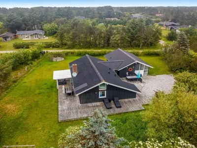 an aerial view of a house with a roof at Holiday Home Lempi - 300m from the sea by Interhome in Løkken