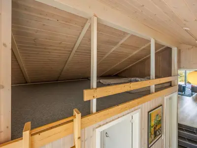 a room with a bunk bed in a house at Holiday Home Elna - 400m from the sea by Interhome in Løkken
