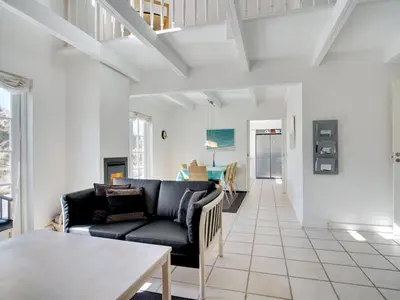 a living room with a couch and a table at Holiday Home Ønef - 1km from the sea by Interhome in Blokhus