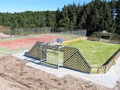 an empty soccer field with a tennis court at Holiday Home Stine - 1km from the sea by Interhome in Blokhus