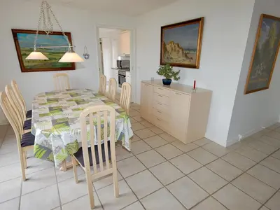 a kitchen and dining room with a table and chairs at Holiday Home Stine - 1km from the sea by Interhome in Blokhus