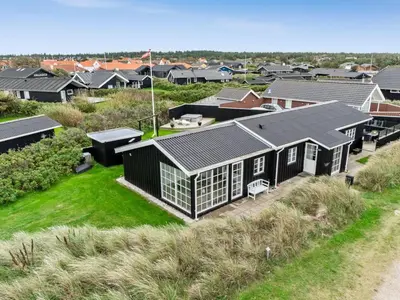 an aerial view of a residential neighborhood with houses at Holiday Home Wiebke - 200m from the sea by Interhome in Blokhus