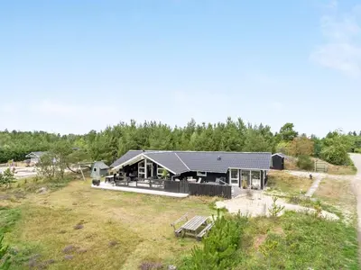 an aerial view of a house on a field at Holiday Home Elayne - 3km from the sea by Interhome in Blokhus