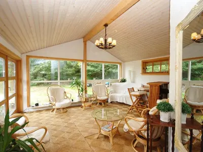 a living room with a table and chairs at Holiday Home Tajo - 1km from the sea by Interhome in Blokhus