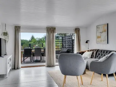a living room with a couch and chairs at Holiday Home Noralee - 3-5km from the sea by Interhome in Blokhus