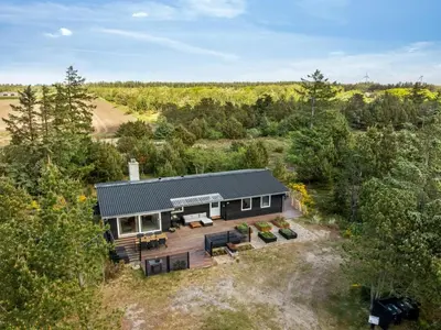 an aerial view of a house with a patio at Holiday Home Noralee - 3-5km from the sea by Interhome in Blokhus