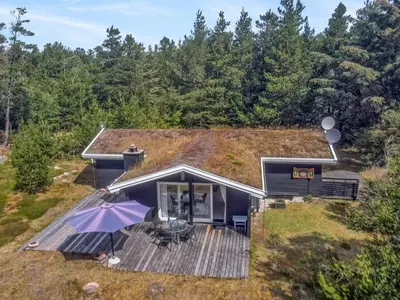 an overhead view of a house with a deck at Holiday Home Heike - 1-3km from the sea by Interhome in Blokhus