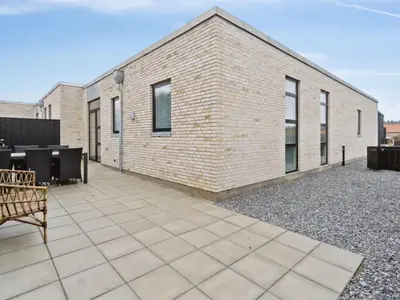 a brick building with a patio in front of it at Holiday Home Klaudius - 2km from the sea by Interhome in Blokhus