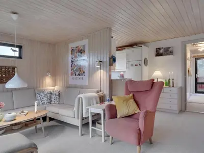 a living room with a couch and a table at Holiday Home Lykka - 950m from the sea by Interhome in Blokhus
