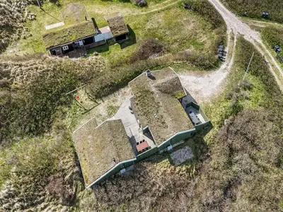 an aerial view of a house in a field at Holiday Home Jobst - 150m from the sea by Interhome in Saltum