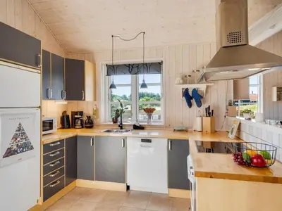 a kitchen with a sink and a counter top at Holiday Home Annemie - 1-8km from the sea by Interhome in Saltum