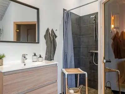 a bathroom with a sink and a shower at Holiday Home Javorka - 1-4km from the sea by Interhome in Saltum