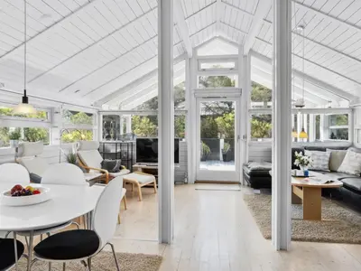 a living room with a white ceiling at Holiday Home Allida - 800m from the sea by Interhome in Saltum