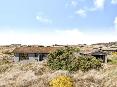 a house in the middle of a field at Holiday Home Ehawee - 350m from the sea by Interhome in Saltum