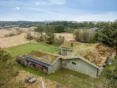 an overhead view of a house with grass on its roof at Holiday Home Ayelen - 600m from the sea by Interhome in Saltum