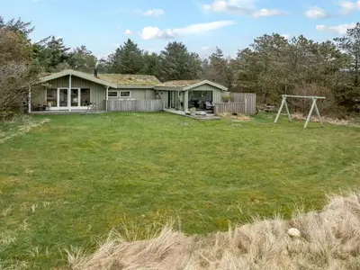 a home with a large yard with a house at Holiday Home Ayelen - 600m from the sea by Interhome in Saltum