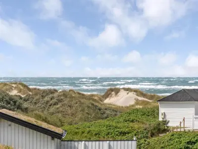 a beach house with a view of the ocean at Holiday Home Kulle - 200m from the sea by Interhome in Saltum