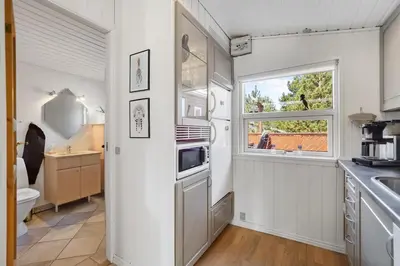 a kitchen with a sink and a window at Cozy Holiday Home in Lovely Surroundings in Sønder Vorupør