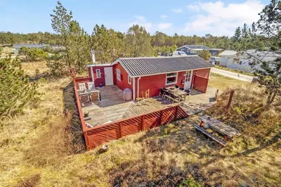 an overhead view of a red house with a deck at Cozy Holiday Home in Lovely Surroundings in Sønder Vorupør