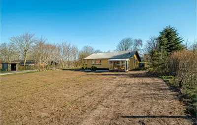 a house with a dirt road in front of it at 3 Bedroom Awesome Home In Thisted in Thisted