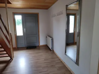 a hallway with two doors and a mirror at Hjortdal B&B in Fjerritslev