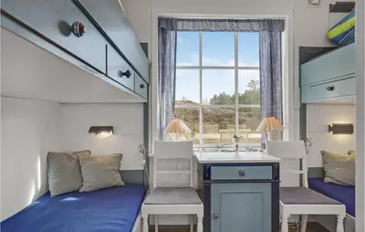a small room with a bed and a sink and a window at Awesome Home In Fjerritslev With Wifi in Fjerritslev