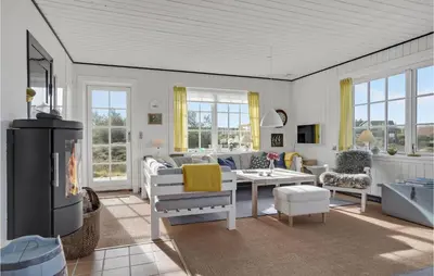 a living room with a couch and a tv at Awesome Home In Fjerritslev With Wifi in Fjerritslev