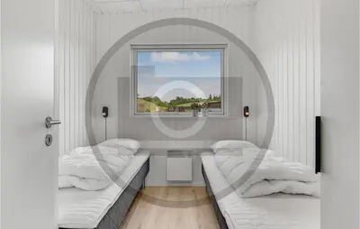 a room with two beds and a window at 4 Bedroom Beautiful Home In Løgstrup in Løgstrup