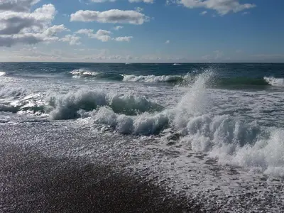 a wave in the ocean on a beach at 4 person holiday home in Frøstrup in Frøstrup