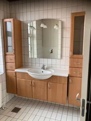 a bathroom with a sink and a mirror at Store Sand in Vemb