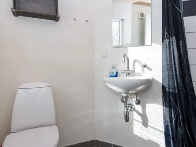 a bathroom with a white toilet and a sink at 6 person holiday home in Vemb-By Traum in Vemb