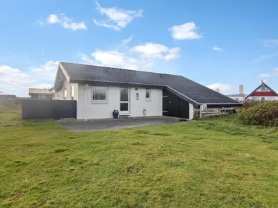 a white house with a large yard in a field at Holiday Home Ågot - 75m from the sea by Interhome in Torsted