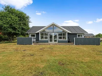 a house with a large yard in front of it at Holiday Home Daina - 400m to the fjord by Interhome in Vemb