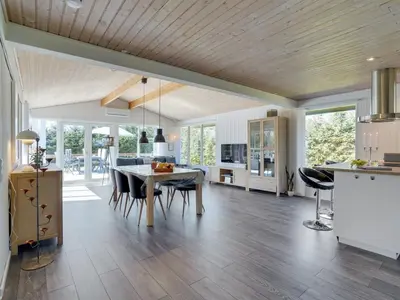 a kitchen and dining room with a table and chairs at Holiday Home Matilde - 400m to the fjord by Interhome in Struer