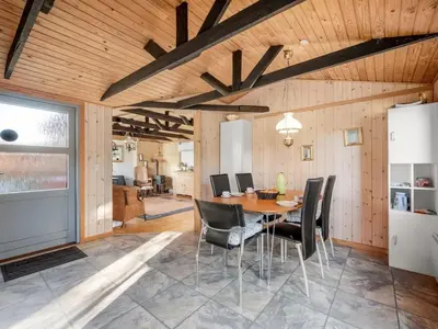 a dining room with a table and chairs at Holiday Home Alpi - 250m to the fjord by Interhome in Struer