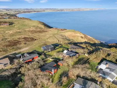 an aerial view of houses on a hill next to the water at Holiday Home Alpi - 250m to the fjord by Interhome in Struer