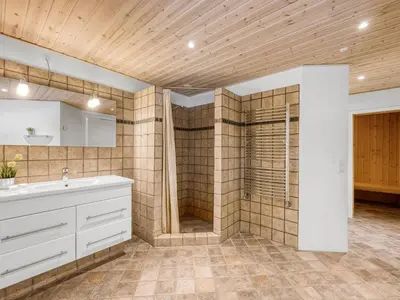 a bathroom with a shower and a white sink at Holiday Home Ginny - 300m to the fjord by Interhome in Struer