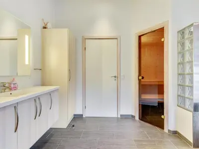 a white bathroom with a sink and a shower at Holiday Home Nani - 900m from the sea by Interhome in Torsted