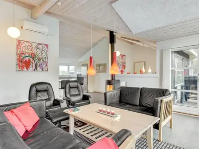 a living room with a couch and a table at Holiday Home Nani - 900m from the sea by Interhome in Torsted